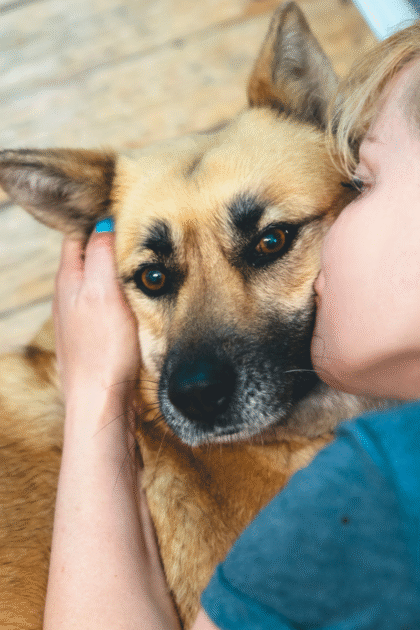 woman hugging her dog